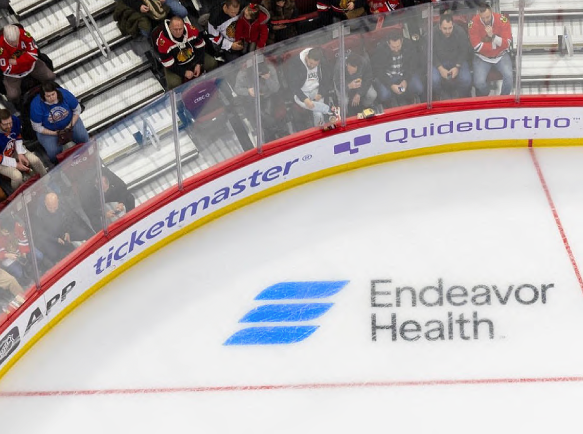 Endeavor Health logo on hockey rink ice