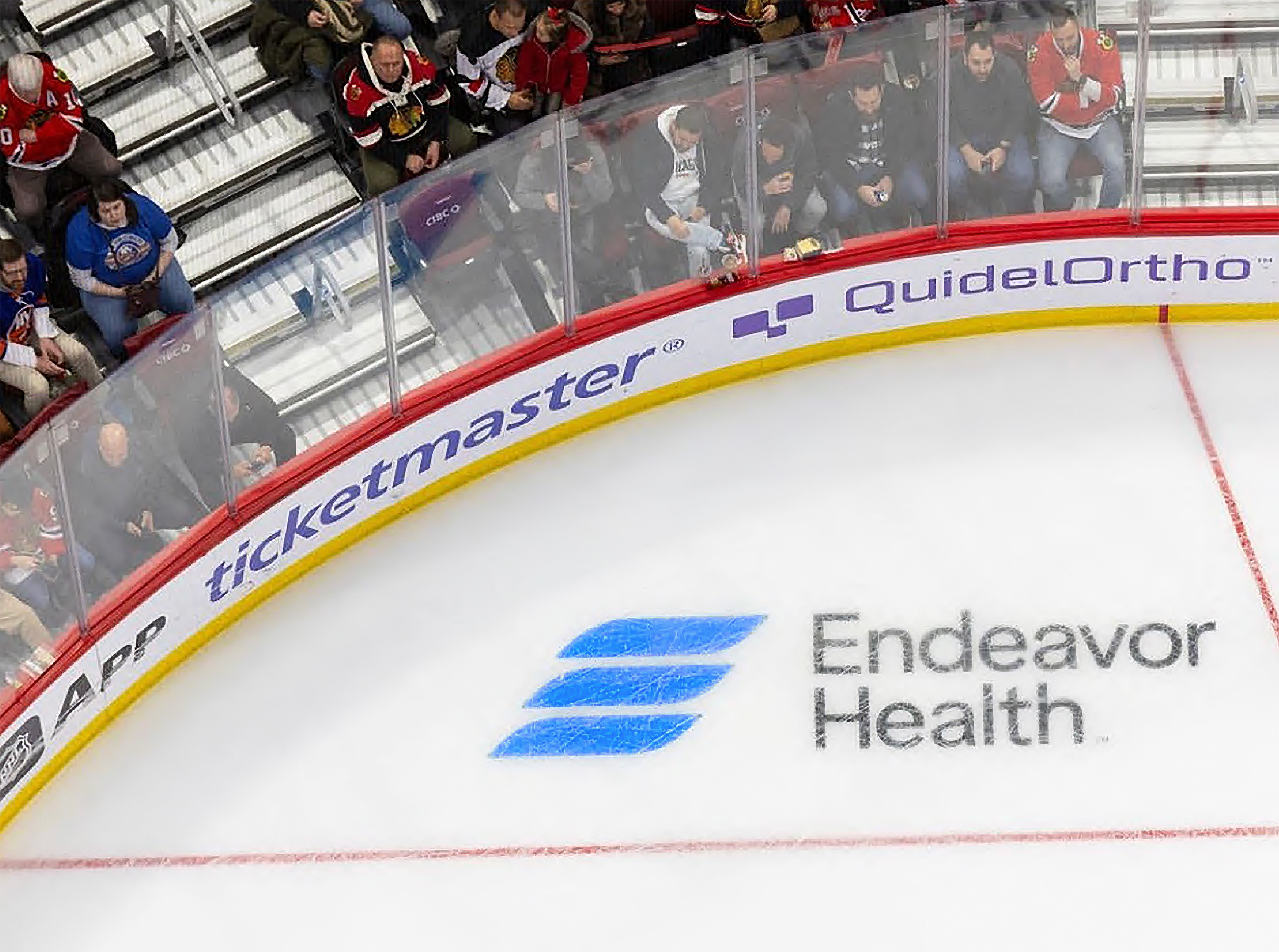 Endeavor Health logo on hockey rink ice