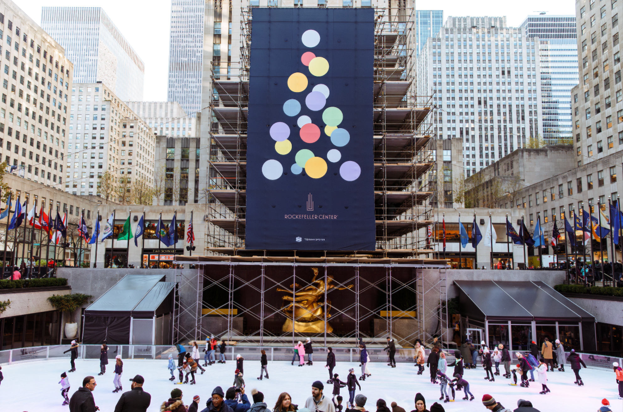 Rockefeller Center ice rink with Christmas tree billboard