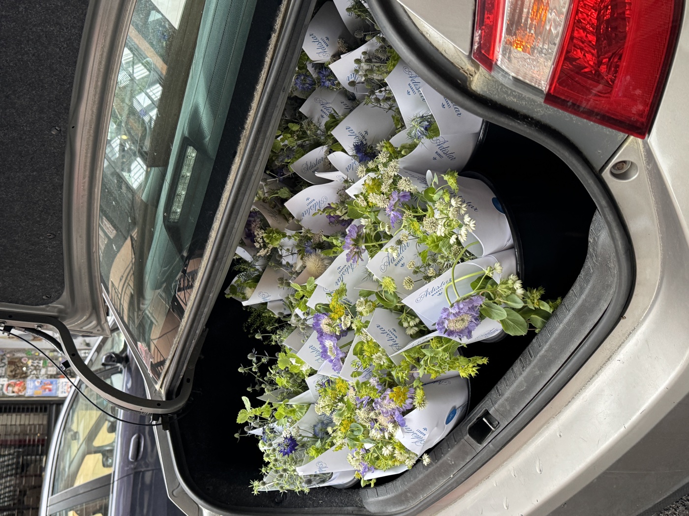 Adistar Market bouquets in car trunk